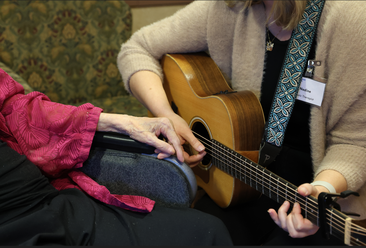music therapy playing guitar